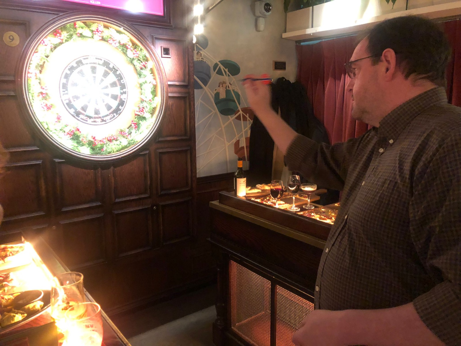 The late Paul Bannister winning at darts (again).