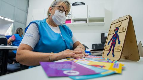 A health worker is preparing educational materials about heart disease in São Paulo, Brazil