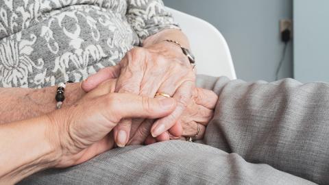 hands together on lap