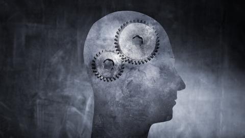 Conceptual image of cogs turning in the human brain