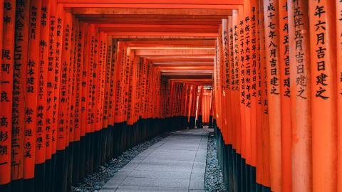 traditional red and black painted bamboo walkway in Japan