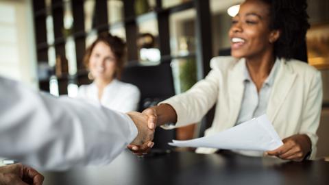 Employees at modern office in meeting room