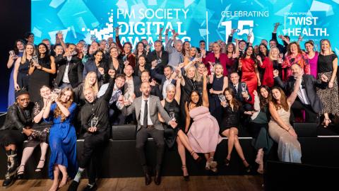 Winners gather in front of the PM Society Digital Awards 2024 banner