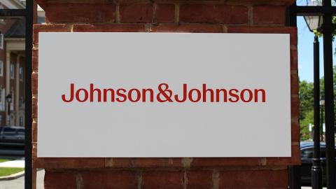 Johnson & Johnson sign on brick pillar