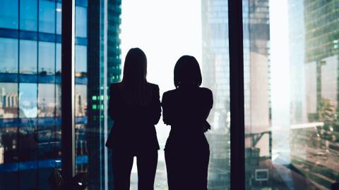 business women looking out