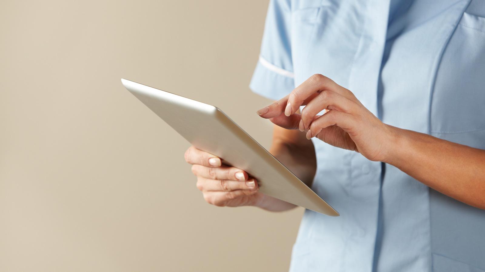 nurse using tablet