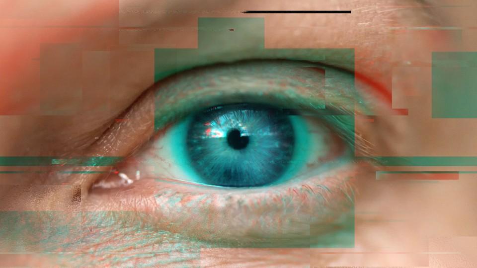 Televisual glitch over a female green eye