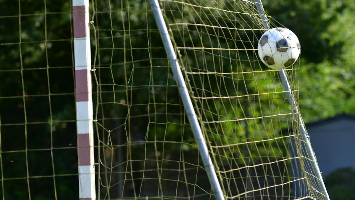 Soccer ball entering goal