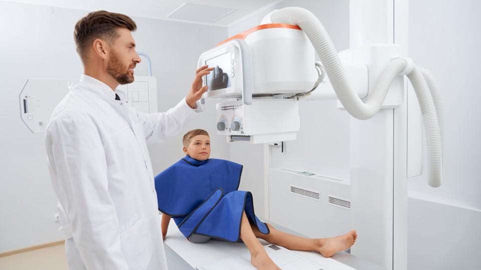 Boy and physician, prepping for scan