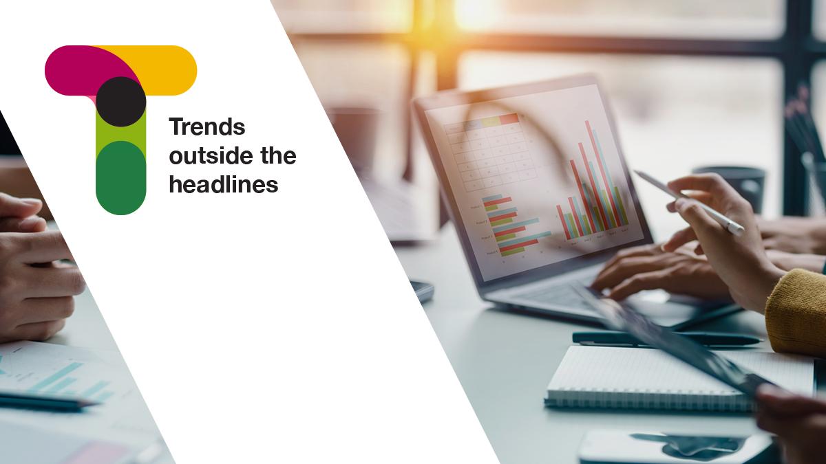 Trends outside the headlines, people reviewing graphs