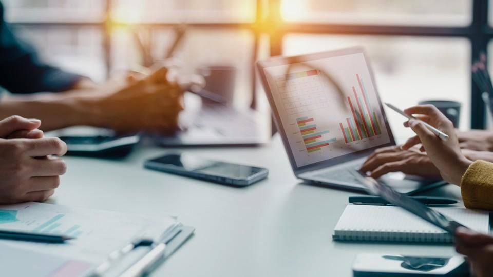 Metrics discussion around boardroom table