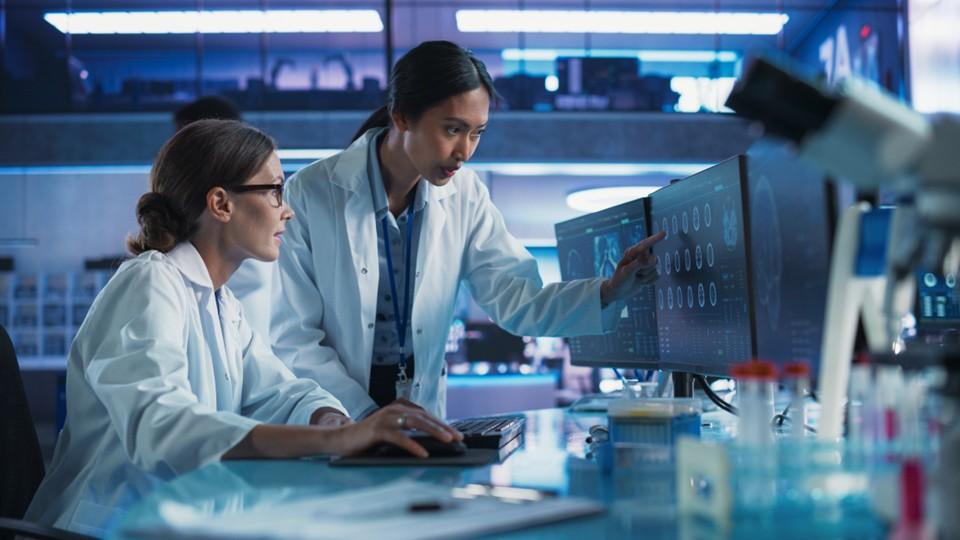 Oncologists assessing a brain scan