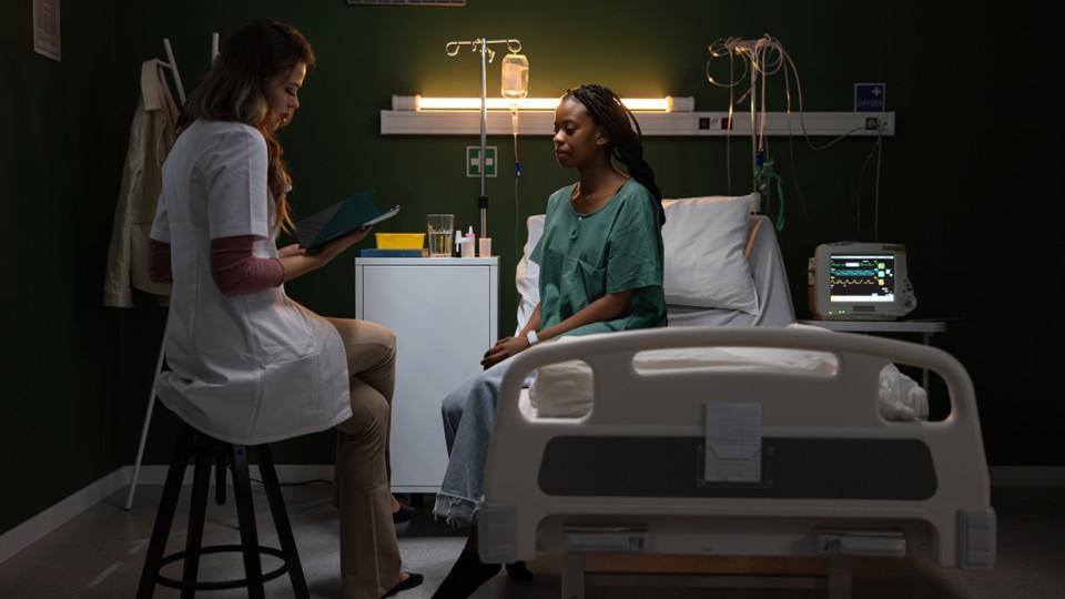 Female patient engages with her female doctor