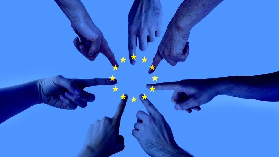 Hands in a circle point to the middle where EU stars are, blue background