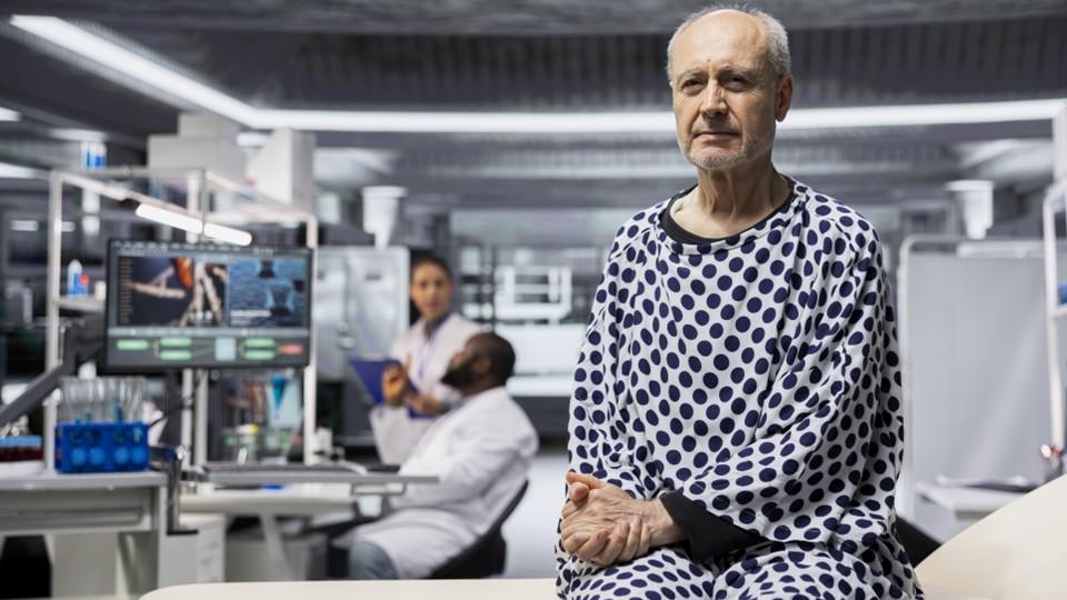 A man sits in a laboratory, participant in a clinical trial