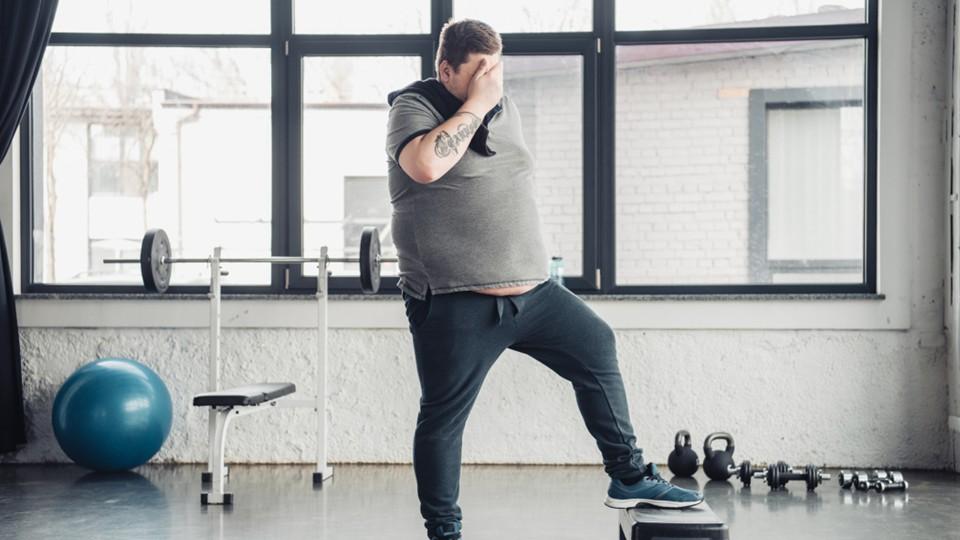 Overweight man in gym