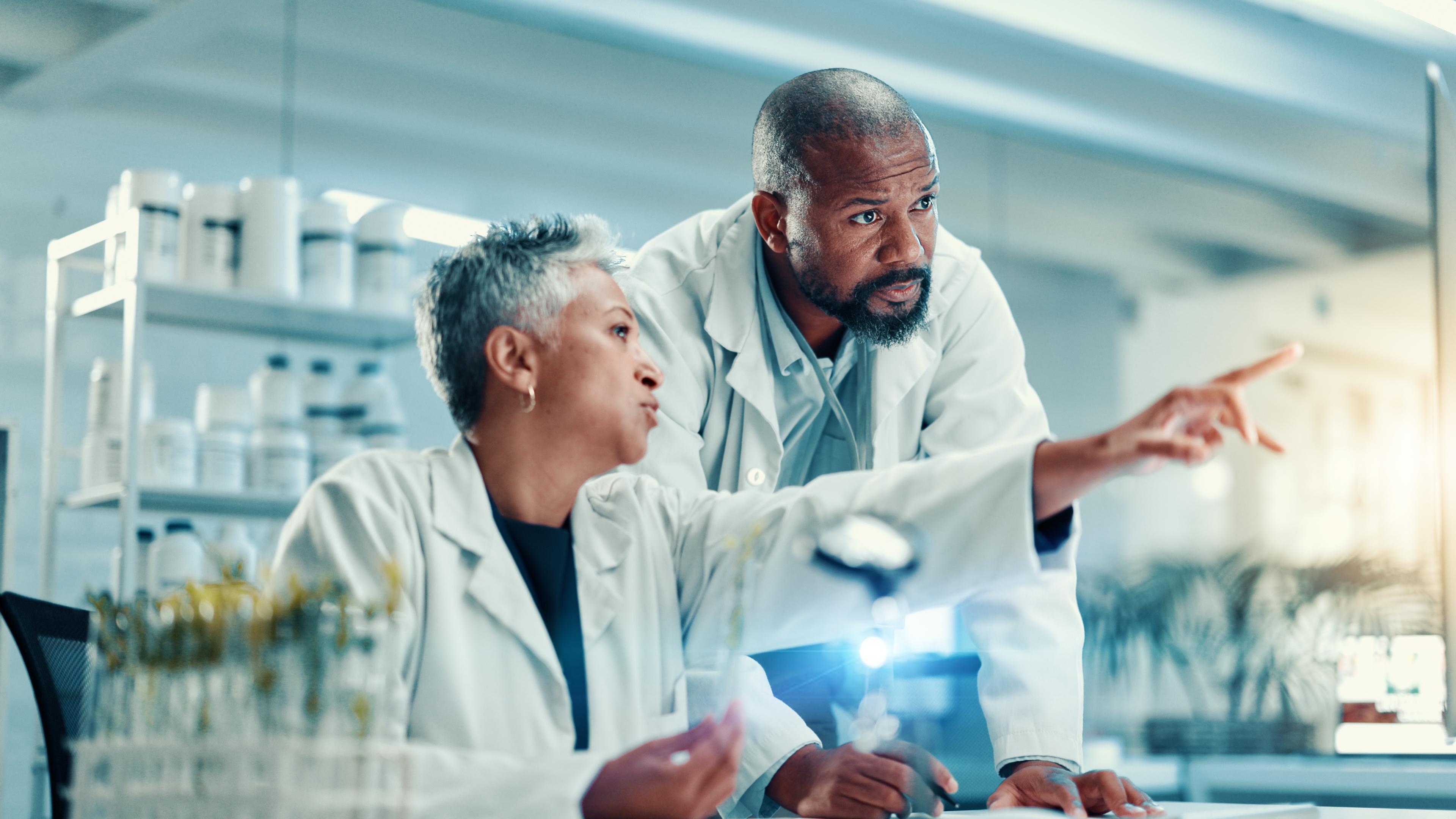 Biomedical researchers discuss results