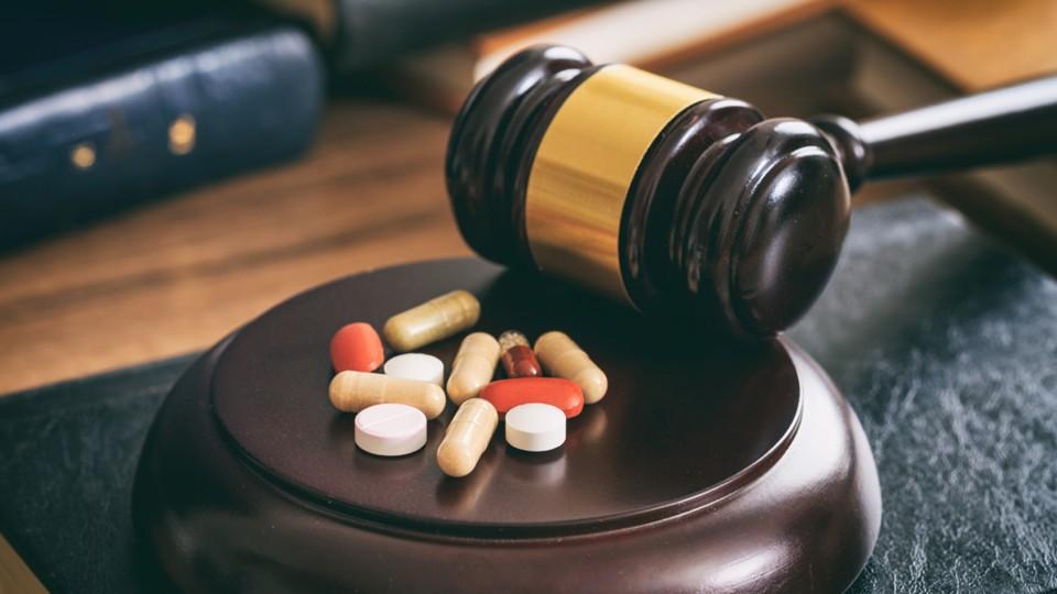 judgement concept with gavel by pills