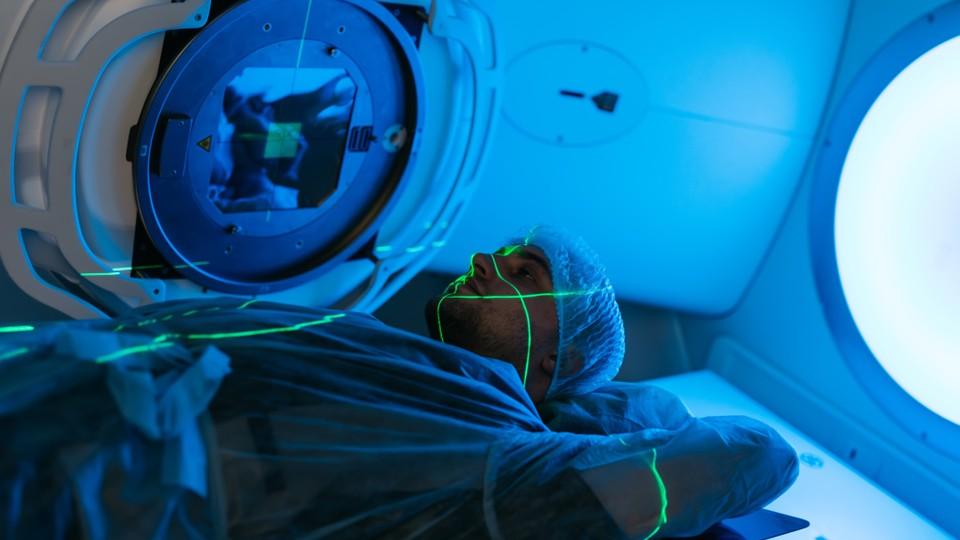 radiotherapy session for young man with cancer