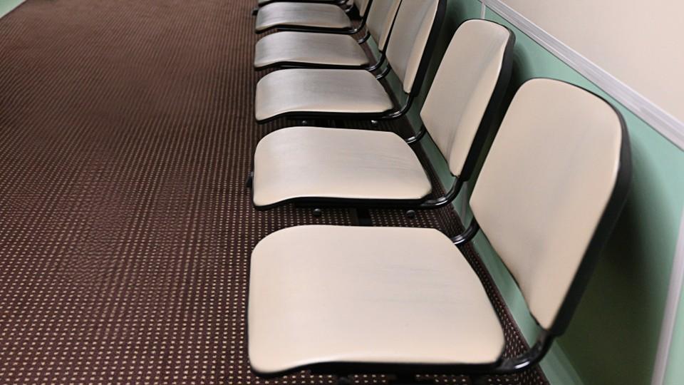 Empty waiting room chairs for clinical trial enrolment