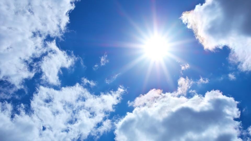 Blue sky with white clouds and bright sunlight