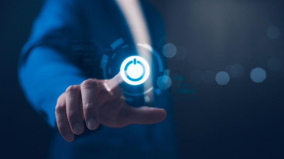 Businessman presses power off for AI