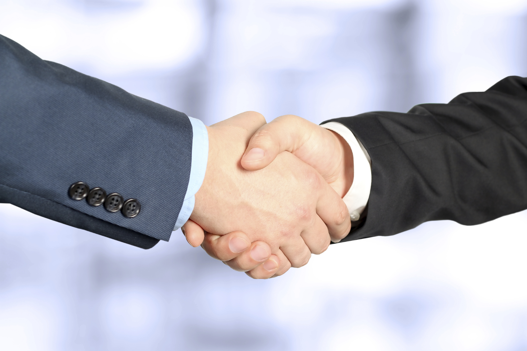 Close-up image of a firm handshake  between two colleagues