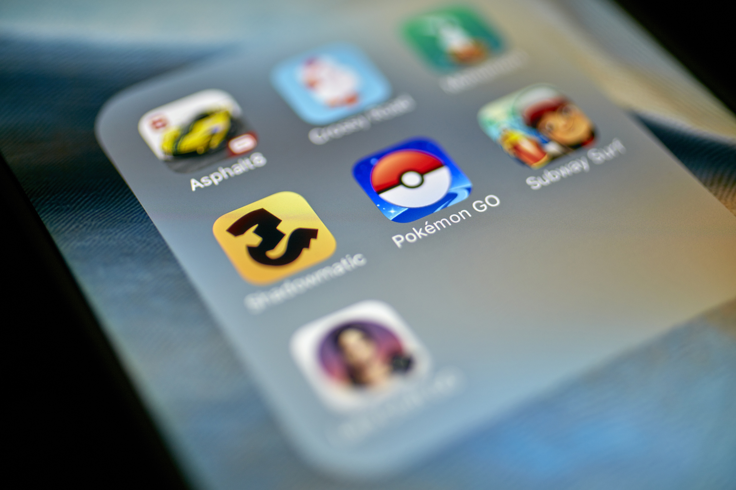 Istanbul, Turkey - July 14, 2016: Macro closeup image of Pokemon Go game app icon among other game icons on an iPhone.