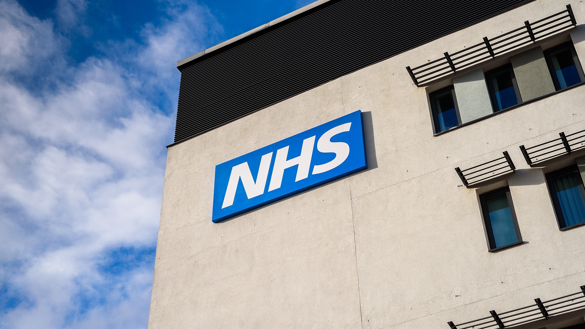 Warrington, United Kingdom - March 6, 2016: Warrington, UK - march 6, 2016: View of the NHS (National Health Service)  logo at the Springfields Medical Centre in the centre of Warrington, Cheshire.