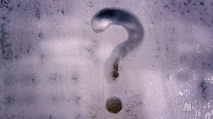 The question mark on frosted glass window