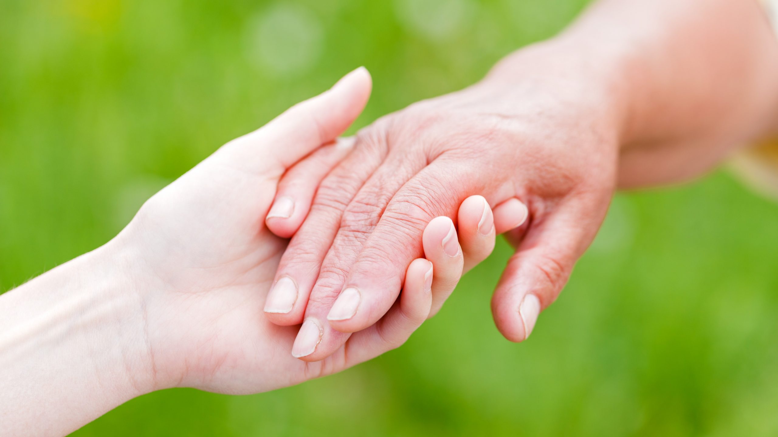 The young woman support the elderly woman