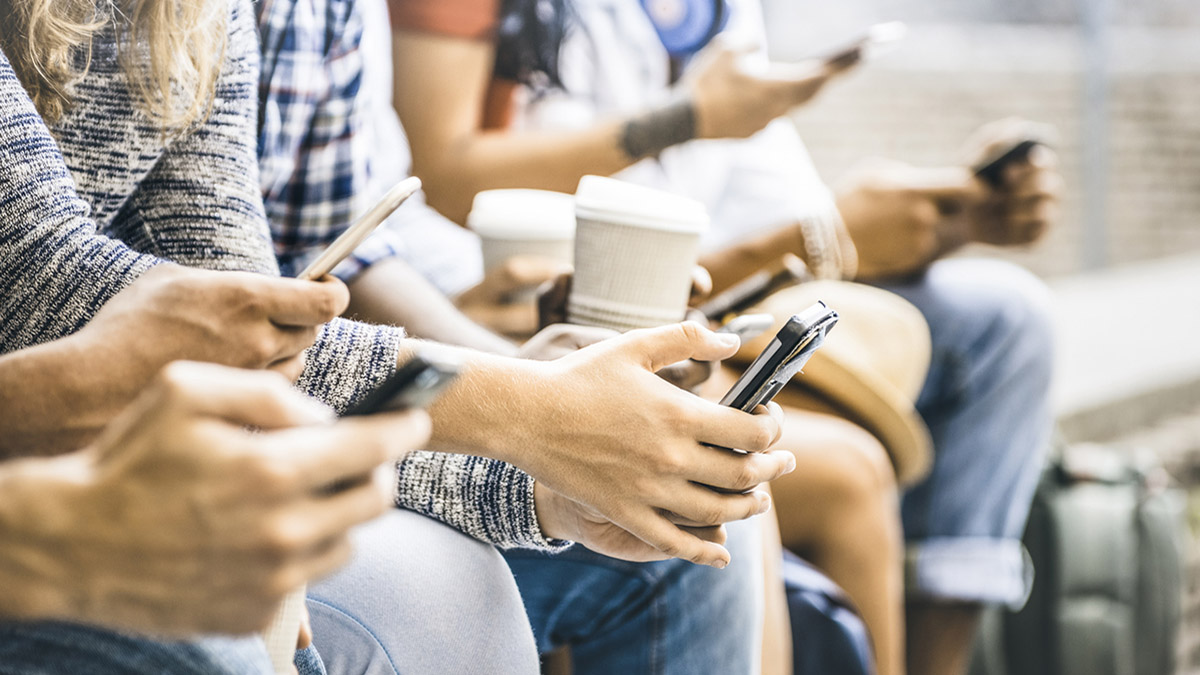 Multicultural friends group using smartphone with coffee at university college break - People hands addicted by mobile smart phone - Technology concept with connected trendy millennials - Filter image