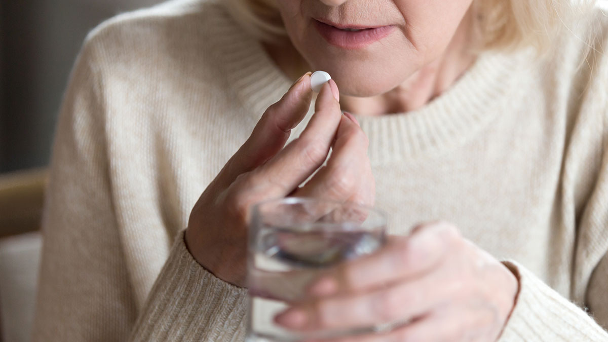 Patient taking a pill