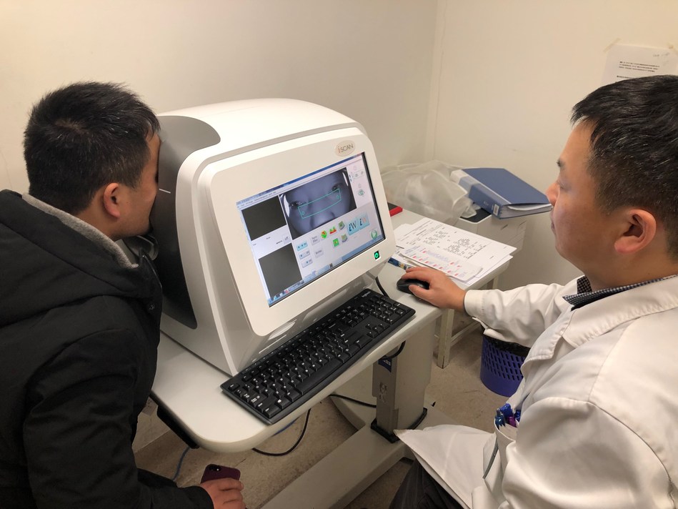 The ophthalmologist operating the optical coherence tomography (OCT) retinal disease screening system (PRNewsfoto/Ping An Insurance (Group) Compa)