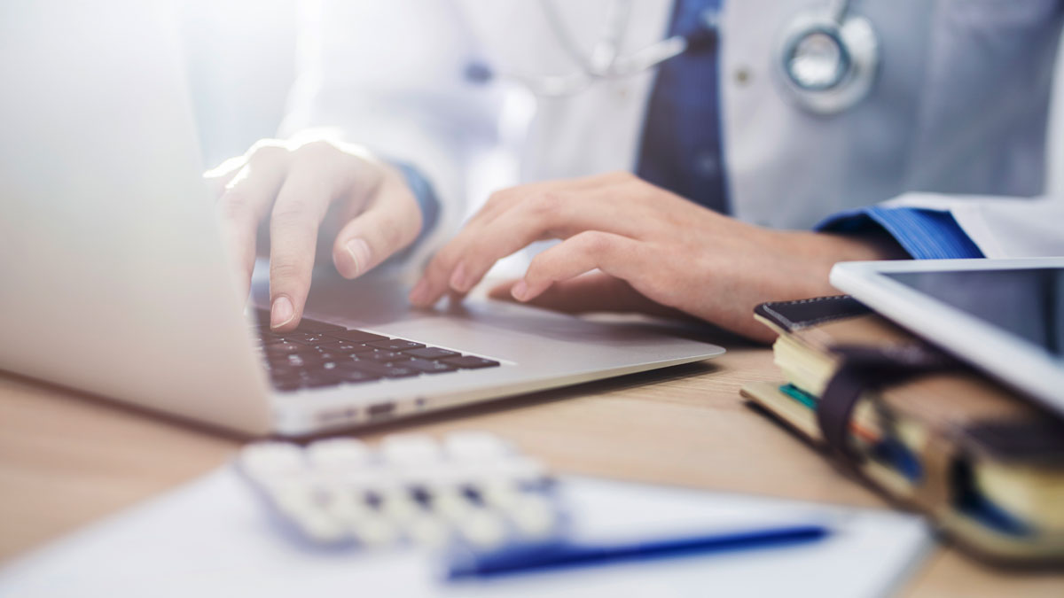 doctor on a computer working