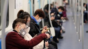 Chinese people wearing surgical mask sitting in subway