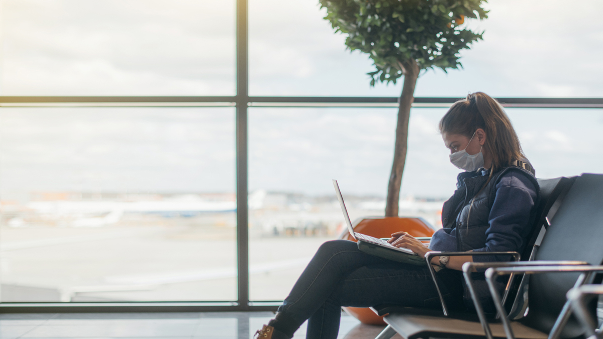 Covid-19 Wearing mask in an airport departure lounge