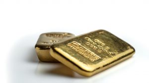 Two cast gold bars of different weights.