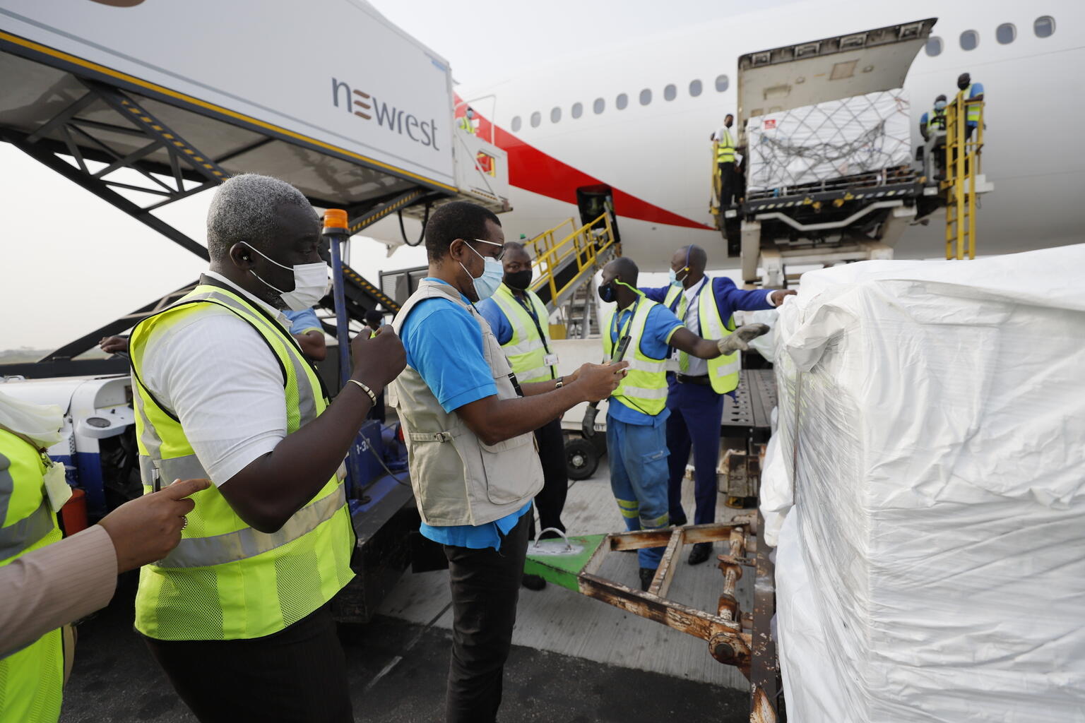 On 24 February 2021, staff unloads the first shipment of COVID-19 vaccines distributed by the COVAX Facility at the Kotoka International Airport in Accra, Ghana's capital.

CREDIT: Francis Kokoroko/COVAX