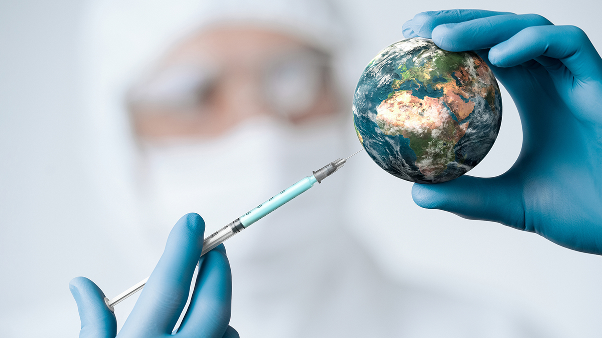 Pandemic concept, close up of scientist injecitng vaccine into the earth