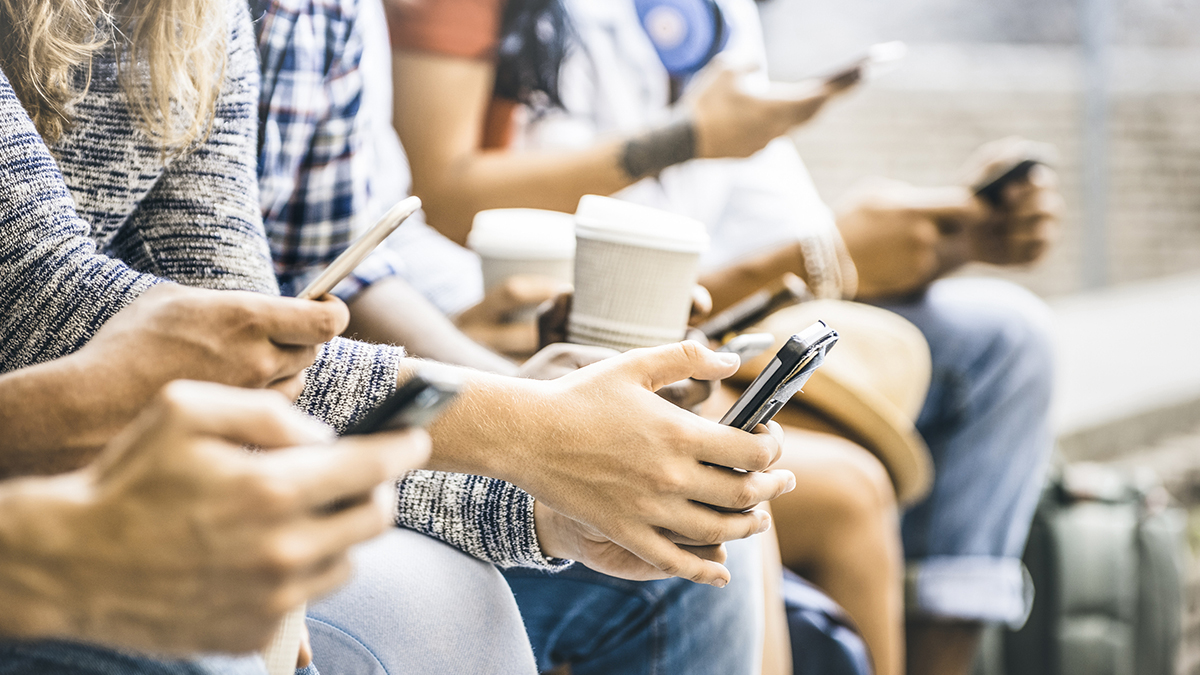 Multicultural friends group using smartphone with coffee at university college break - People hands addicted by mobile smart phone - Technology concept with connected trendy millennials - Filter image