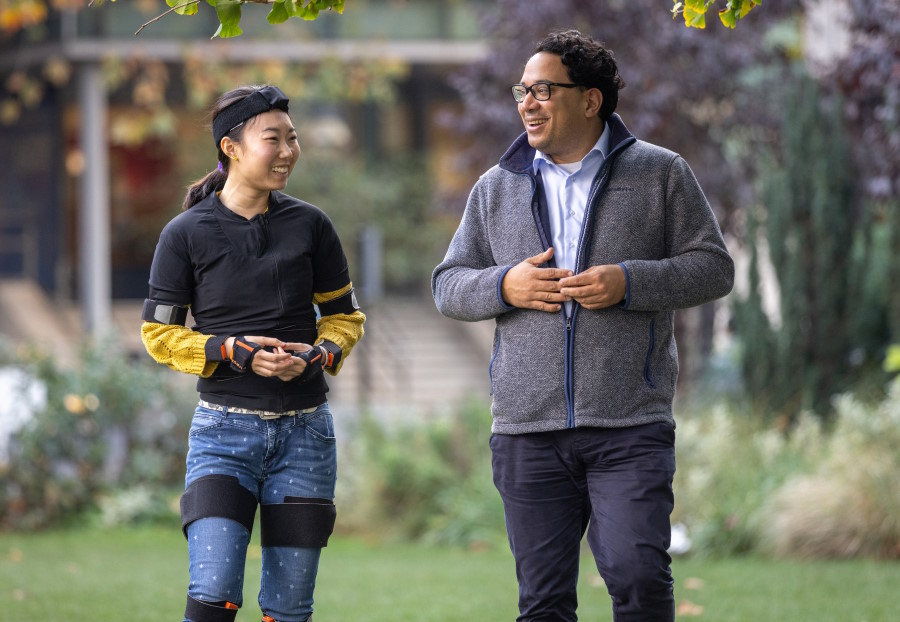 Aldo Faisal and Tracking ethomic biomarkers.
Bodily movement sensors combined with new AI tool allow researchers to track movements and predict disease progression in movement disorders.

Aldo is pictured with Ms Luchen Li, Department of Computing who is wearing the sensor suit.

Dr Balasundaram Kadirvelu who leads on the project is pictured seated with Luchen in some of the images with the bodysuit.